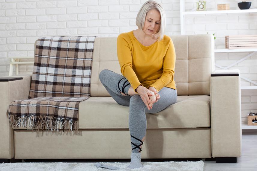 Woman messaging her foot