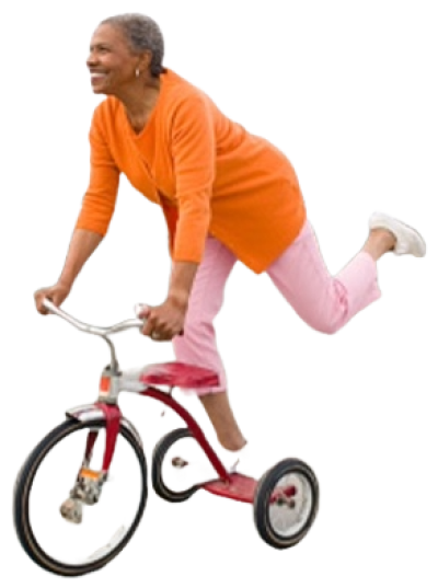 An older lady being silly and riding a tricycle