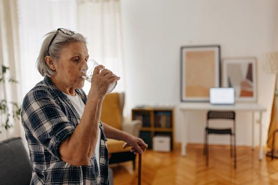 Senior woman drinking glass of water